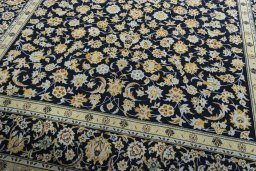 Close-up detail of 2000s Kashan rug from Iran / Persia showing Wool weave