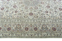 Corner detail of 2000s Kashan rug showing border pattern and Wool pile