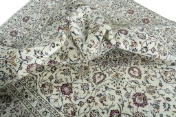 Surface texture of 2000s Kashan rug with natural Wool and intricate pattern