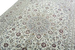 Backside of handmade 2000s Kashan rug showing knot structure and weave density