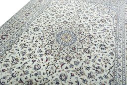 Backside of handmade 2000s Kashan rug showing knot structure and weave density