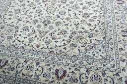 Close-up detail of 2000s Kashan rug from Iran / Persia showing Wool weave