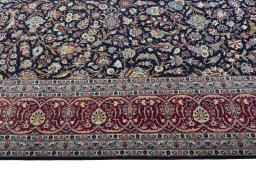 Close-up detail of 2000s Kashan rug from Iran / Persia showing Wool weave
