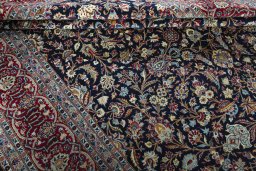 Surface texture of 2000s Kashan rug with natural Wool and intricate pattern