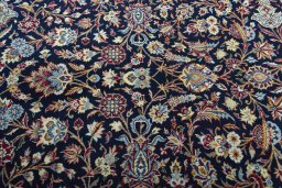 Close-up detail of 2000s Kashan rug from Iran / Persia showing Wool weave