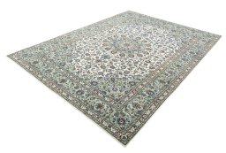 Corner detail of 2000s Kashan rug showing border pattern and Wool pile