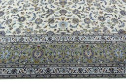 Corner detail of 2000s Kashan rug showing border pattern and Wool pile