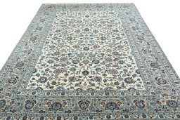 Surface texture of 2000s Kashan rug with natural Wool and intricate pattern