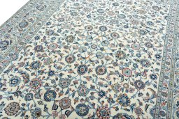 Backside of handmade 2000s Kashan rug showing knot structure and weave density