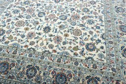 Close-up detail of 2000s Kashan rug from Iran / Persia showing Wool weave