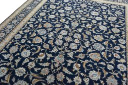 Backside of handmade 2000s Kashan rug showing knot structure and weave density