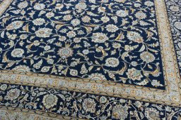 Close-up detail of 2000s Kashan rug from Iran / Persia showing Wool weave