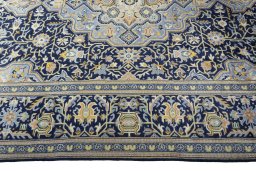 Corner detail of 2000s Kashan rug showing border pattern and Wool pile