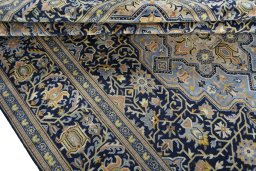 Close-up detail of 2000s Kashan rug from Iran / Persia showing Wool weave