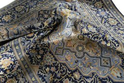 Surface texture of 2000s Kashan rug with natural Wool and intricate pattern