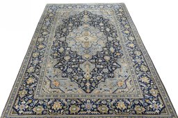 Surface texture of 2000s Kashan rug with natural Wool and intricate pattern