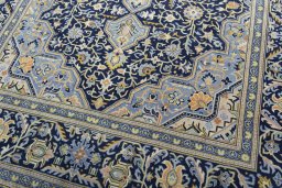 Close-up detail of 2000s Kashan rug from Iran / Persia showing Wool weave