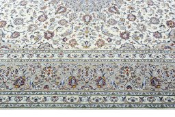 Corner detail of 2000s Kashan rug showing border pattern and Wool pile