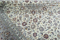Close-up detail of 2000s Kashan rug from Iran / Persia showing Wool weave