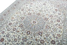 Backside of handmade 2000s Kashan rug showing knot structure and weave density