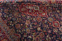 Close-up detail of 2000s Kashan rug from Iran / Persia showing Wool weave