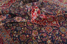 Surface texture of 2000s Kashan rug with natural Wool and intricate pattern