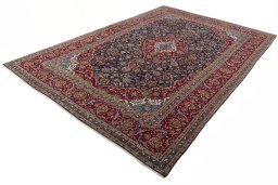 Corner detail of 2000s Kashan rug showing border pattern and Wool pile
