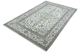Corner detail of 2000s Kashan rug showing border pattern and Wool pile
