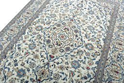 Backside of handmade 2000s Kashan rug showing knot structure and weave density