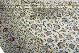 Close-up detail of 2000s Kashan rug from Iran / Persia showing Wool weave