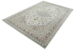 Corner detail of 2000s Kashan rug showing border pattern and Wool pile
