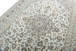 Backside of handmade 2000s Kashan rug showing knot structure and weave density