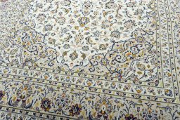 Close-up detail of 2000s Kashan rug from Iran / Persia showing Wool weave