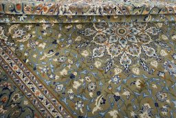Close-up detail of 2000s Kashan rug from Iran / Persia showing Wool weave