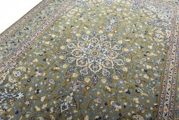 Backside of handmade 2000s Kashan rug showing knot structure and weave density