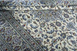 Close-up detail of 2000s Kashan rug from Iran / Persia showing Wool weave