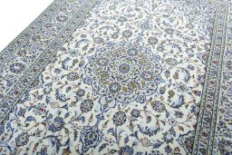 Backside of handmade 2000s Kashan rug showing knot structure and weave density