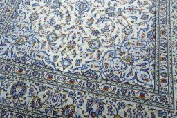 Close-up detail of 2000s Kashan rug from Iran / Persia showing Wool weave