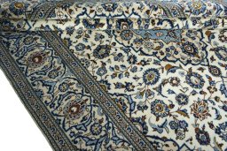Close-up detail of 2000s Kashan rug from Iran / Persia showing Wool weave