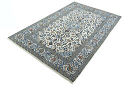 Corner detail of 2000s Kashan rug showing border pattern and Wool pile