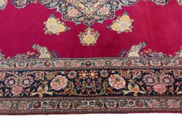 Corner detail of 1930s Kashan rug showing border pattern and Cork pile