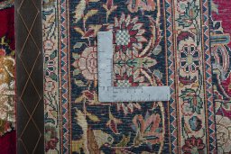 Backside of handmade 1930s Kashan rug showing knot structure and weave density