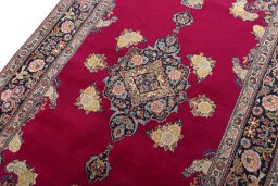 Backside of handmade 1930s Kashan rug showing knot structure and weave density