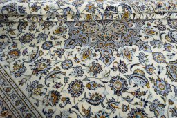 Close-up detail of 2000s Kashan rug from Iran / Persia showing Wool weave