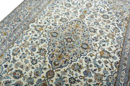 Backside of handmade 2000s Kashan rug showing knot structure and weave density