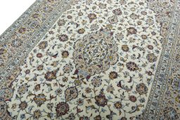 Backside of handmade 2000s Kashan rug showing knot structure and weave density