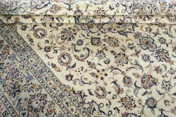Close-up detail of 2000s Kashan rug from Iran / Persia showing Wool weave