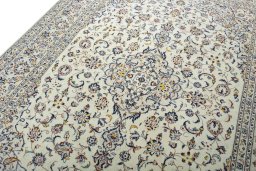 Backside of handmade 2000s Kashan rug showing knot structure and weave density