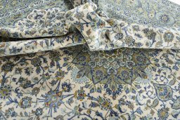 Surface texture of 2000s Kashan rug with natural Cork and intricate pattern