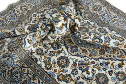 Surface texture of 2000s Kashan rug with natural Wool and intricate pattern